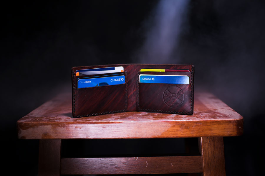 wallet full of credit cards on a table
