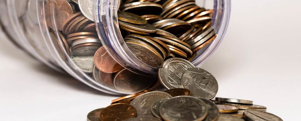 coins falling from a jar