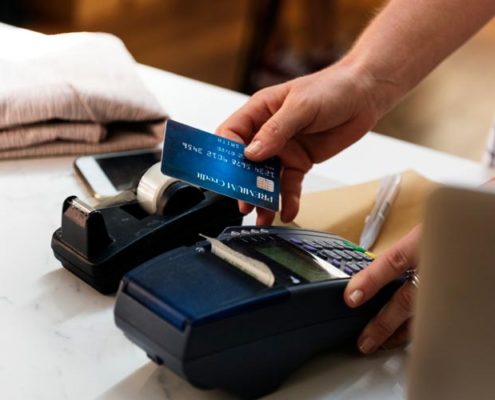 person making a purchase with a credit card