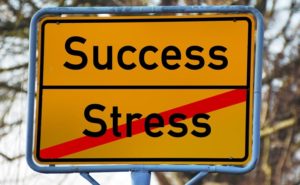 success and stress street sign