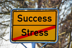 success and stress street sign