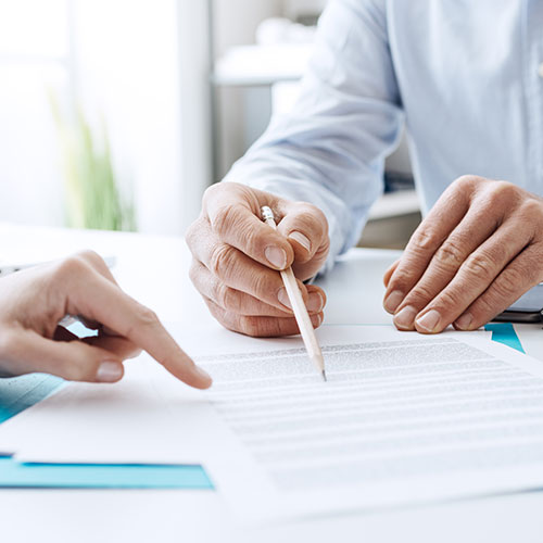 people working on paperwork