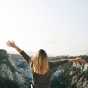 woman standing on a mountain